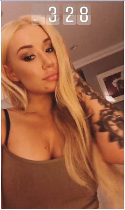 Iggy Azalea shows cleavage and boobs