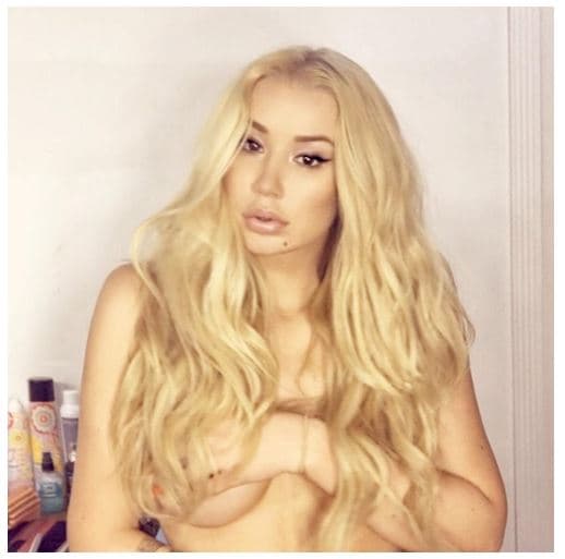 Iggy Azalea showing off her enhanced nude breasts 